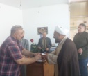 تبریک و اهدای شاخه گل توسط رئیس دانشکدگان فارابی دانشگاه تهران به استادان و همیاران آموزشی در روز گرامیداشت روز معلم و مقام استاد